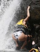 Eva Longoria in Swimsuit under a Fountain in Hawaii