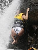 Eva Longoria in Swimsuit under a Fountain in Hawaii