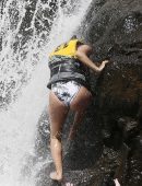 Eva Longoria in Swimsuit under a Fountain in Hawaii