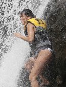 Eva Longoria in Swimsuit under a Fountain in Hawaii