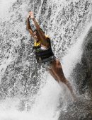 Eva Longoria in Swimsuit under a Fountain in Hawaii