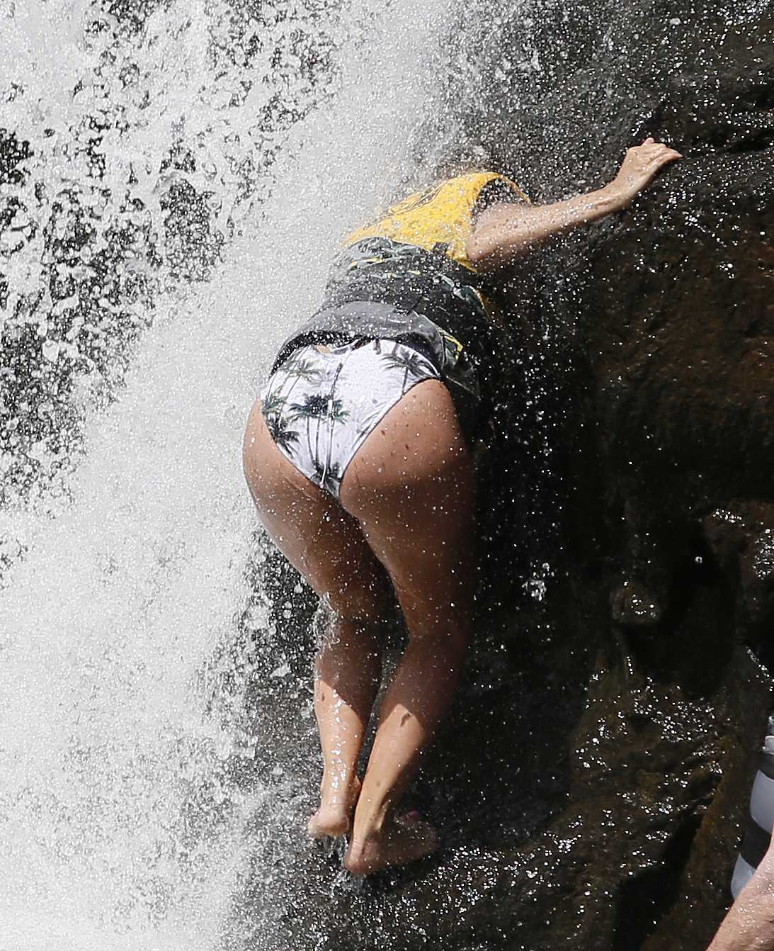 Eva Longoria in Swimsuit under a Fountain in Hawaii