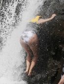 Eva Longoria in Swimsuit under a Fountain in Hawaii
