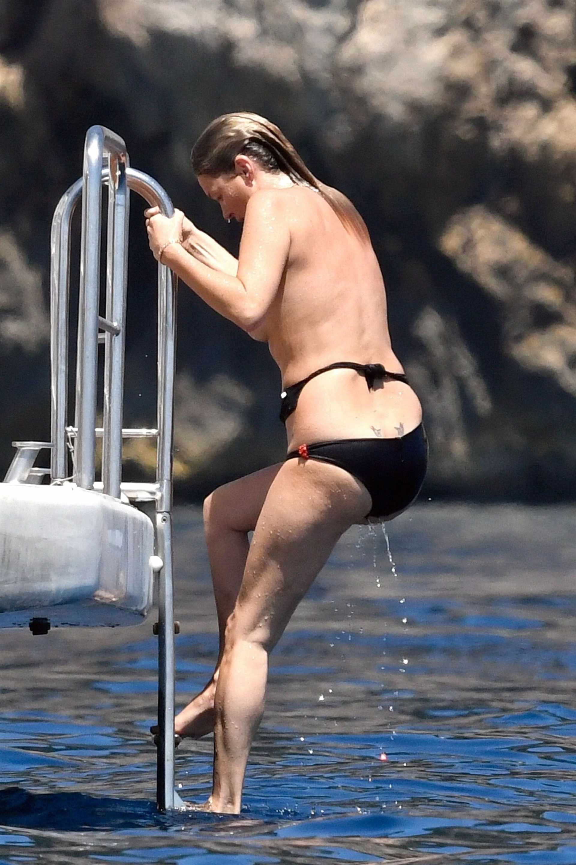 Kate Moss Topless and in Black Bikini in Italy