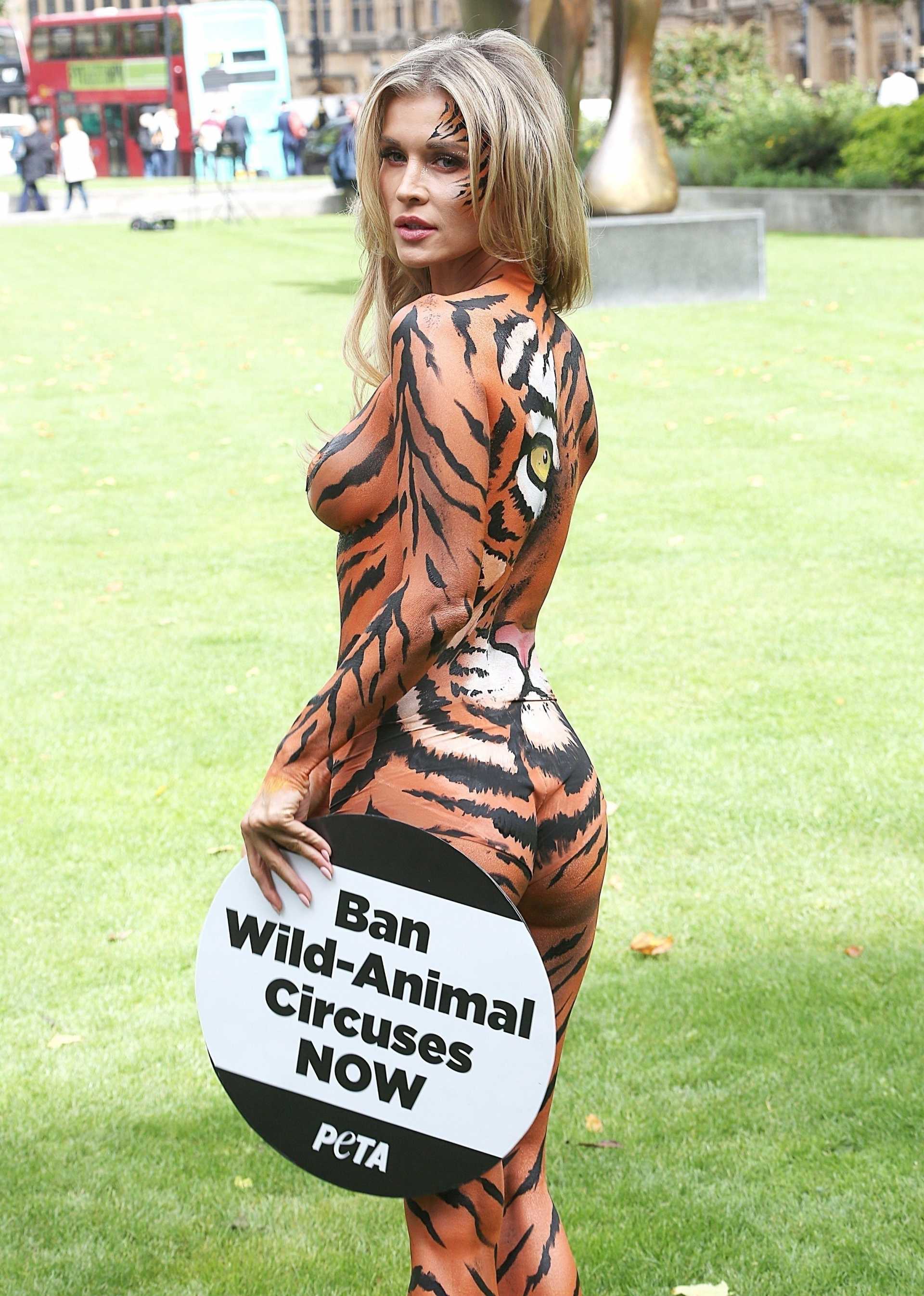 Joanna Krupa wearing Bodypaint while Protesting Outside Westminster, London