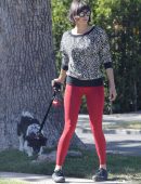 Nina Dobrev in Red Tights walking Dog Maverick in LA
