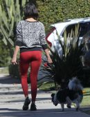 Nina Dobrev in Red Tights walking Dog Maverick in LA