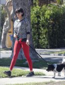 Nina Dobrev in Red Tights walking Dog Maverick in LA