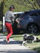 Nina Dobrev in Red Tights walking Dog Maverick in LA