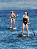Olivia Wilde in Black Swimsuit Surfing in Hawaii