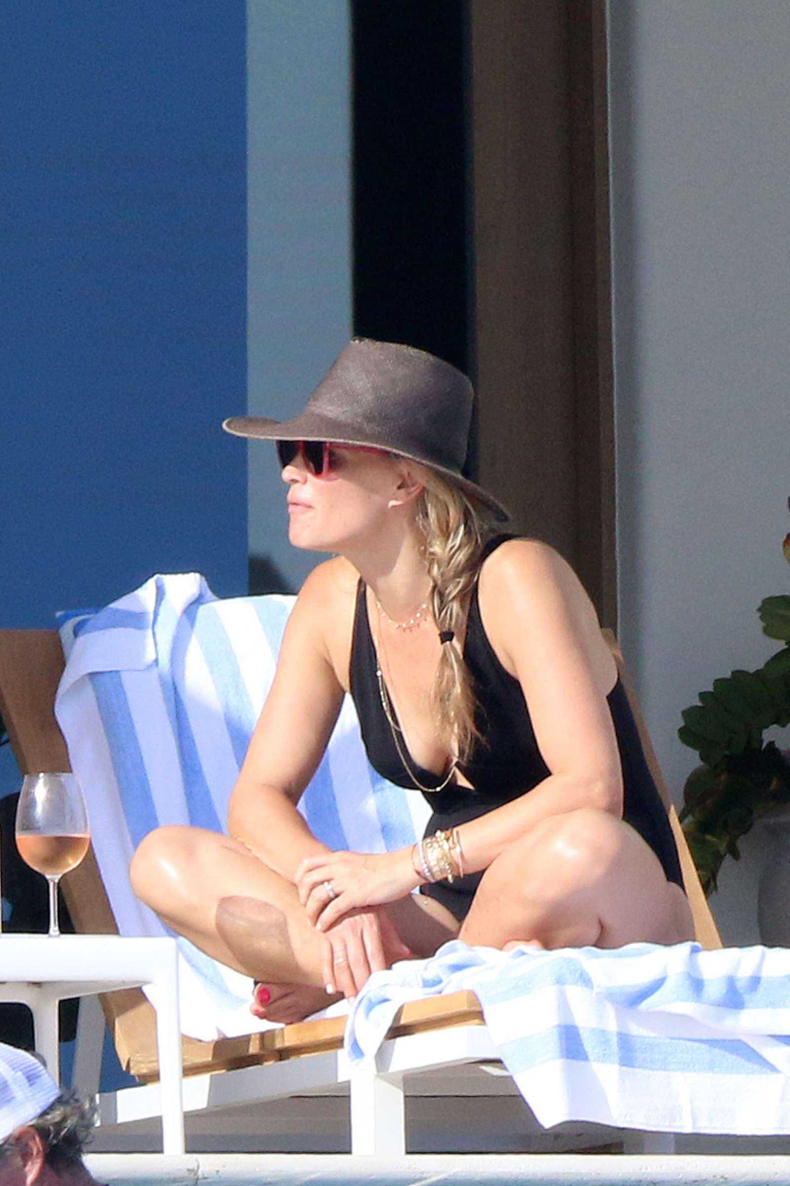 Molly Sims in Black Swimsuit at a Pool in Cabo San Lucas