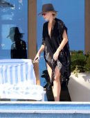 Molly Sims in Black Swimsuit at a Pool in Cabo San Lucas