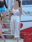 Selena Gomez in White Swimsuit and Pants at a pool and sailing in Montego Bay