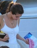 Selena Gomez in White Swimsuit and Pants at a pool and sailing in Montego Bay