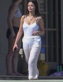 Selena Gomez in White Swimsuit and Pants at a pool and sailing in Montego Bay