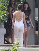 Selena Gomez in White Swimsuit and Pants at a pool and sailing in Montego Bay