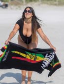 Claudia Romani in Black Swimsuit for Photoshoot at Miami Beach