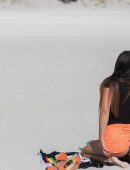 Claudia Romani in Black Swimsuit for Photoshoot at Miami Beach