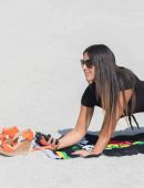 Claudia Romani in Black Swimsuit for Photoshoot at Miami Beach