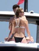 Karlie Kloss in White and Black Bikini on Vacation on a Yacht in Capri