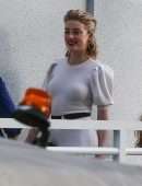 *EXCLUSIVE* Amber Heard shows off a high slit white dress while leaving an interview at Univision Headquarters