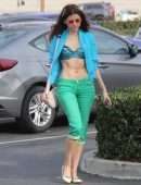Blanca Blanco Walking to the News Stand to Buy a Magazine