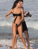 Alexis Ren in Black Bikini at a Beach in Tulum