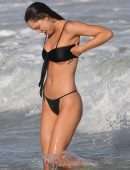 Alexis Ren in Black Bikini at a Beach in Tulum