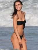 Alexis Ren in Black Bikini at a Beach in Tulum