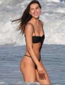 Alexis Ren in Black Bikini at a Beach in Tulum