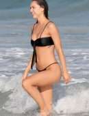 Alexis Ren in Black Bikini at a Beach in Tulum