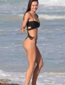 Alexis Ren in Black Bikini at a Beach in Tulum