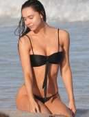 Alexis Ren in Black Bikini at a Beach in Tulum