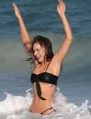 Alexis Ren in Black Bikini at a Beach in Tulum
