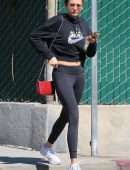 Nina Dobrev in Black Leggings, Walking her Dog Maverick in Hollywood