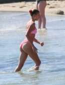 Hailey Baldwin in Pink Bikini at the Beach