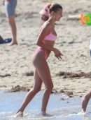 Hailey Baldwin in Pink Bikini at the Beach