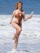Ireland Baldwin in “138 Water” Swimsuit Photoshoot Candids in Malibu
