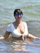 Jackie Cruz in White Bikini Relaxes on Miami Beach