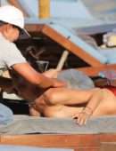 Alessandra Ambrosio in Bikini on a Beach in Mykonos