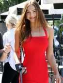 *EXCLUSIVE* Alexis Ren stuns in a red dress while she walks her dog