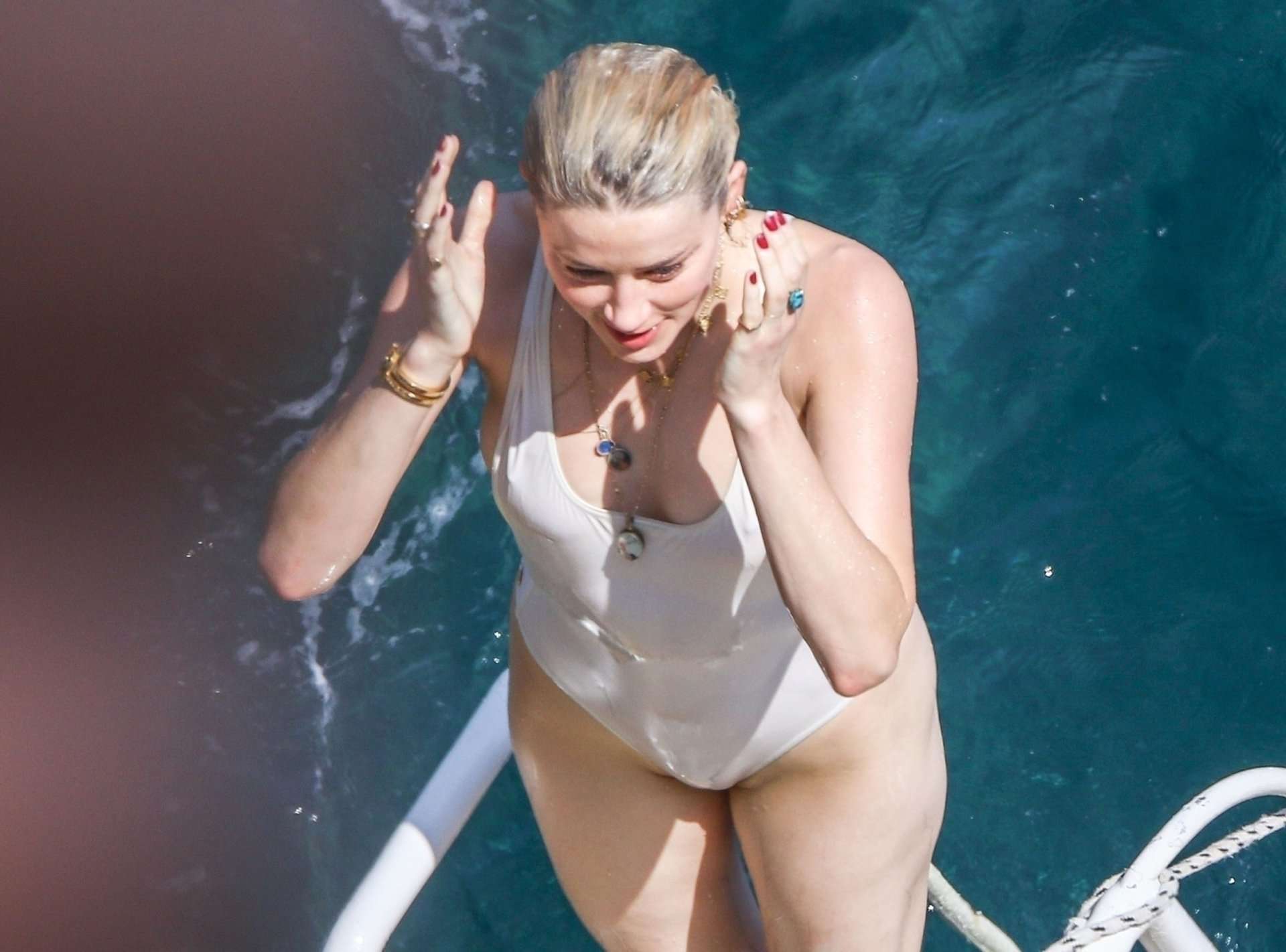 Amber Heard Pokies in Wet White Swimsuit in Amalfi
