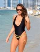 Chloe Goodman in Black Swimsuit on the Beach in Dubai