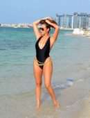 Chloe Goodman in Black Swimsuit on the Beach in Dubai