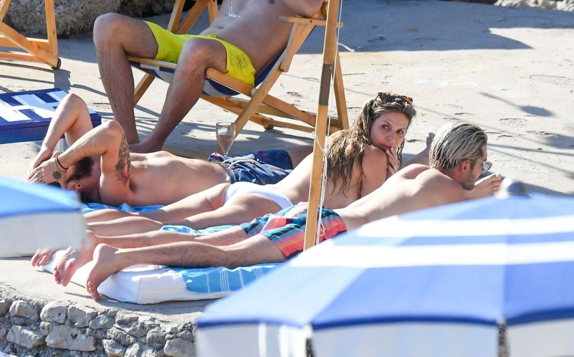 Heidi Klum in White Swimsuit in Capri