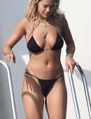 Rita Ora Booty in Black Bikini in Porto Cervo