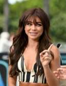Sarah Hyland Leggy on “Extra” at Universal Studios Hollywood in Universal City
