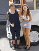Ariana Grande Leggy in Denim Shorts on a Music Video Set