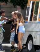 Ariana Grande Leggy in Denim Shorts on a Music Video Set