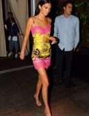 Kendall Jenner slips into a Versace dress for dinner with friends during NYFW